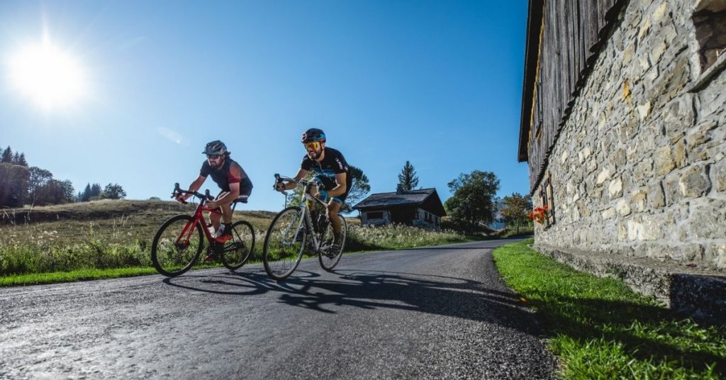 Two men cycling on the roads in Les Gets