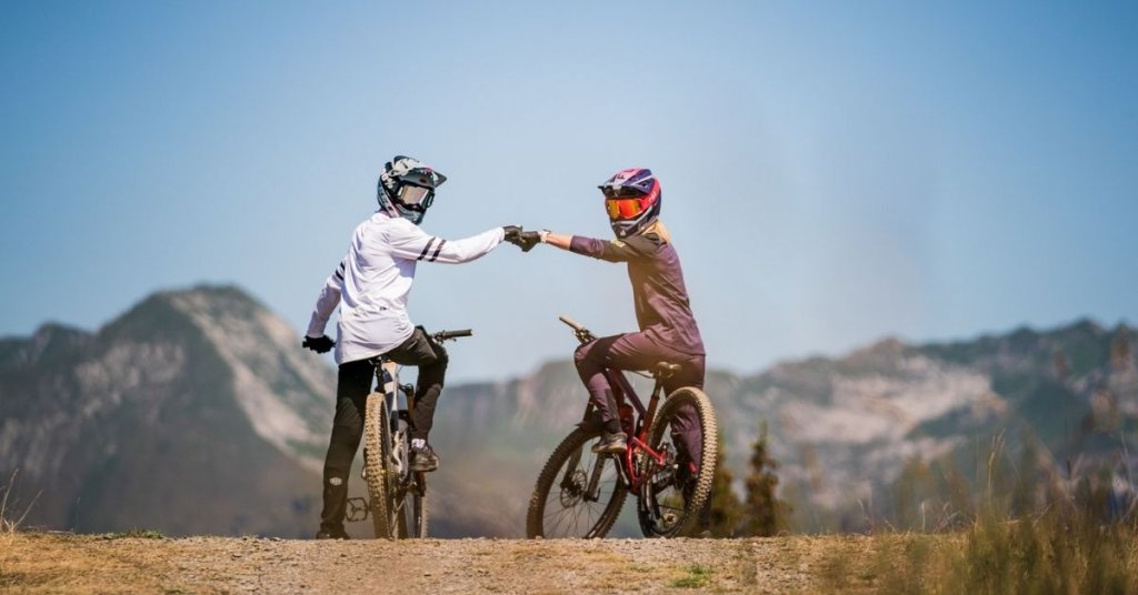 Two teenagers mountain biking